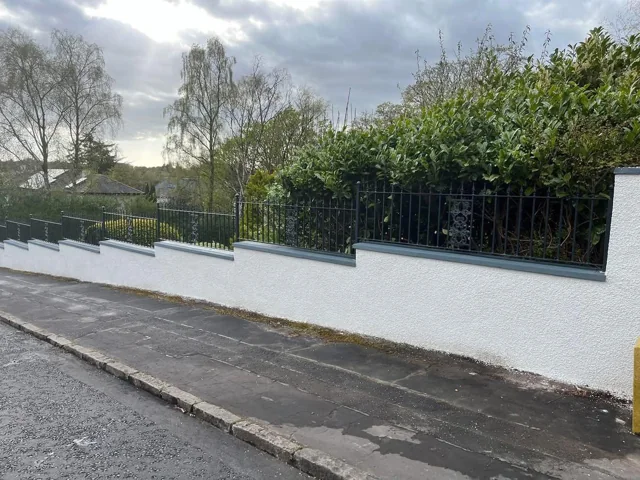 Completed rendered boundary wall with railings